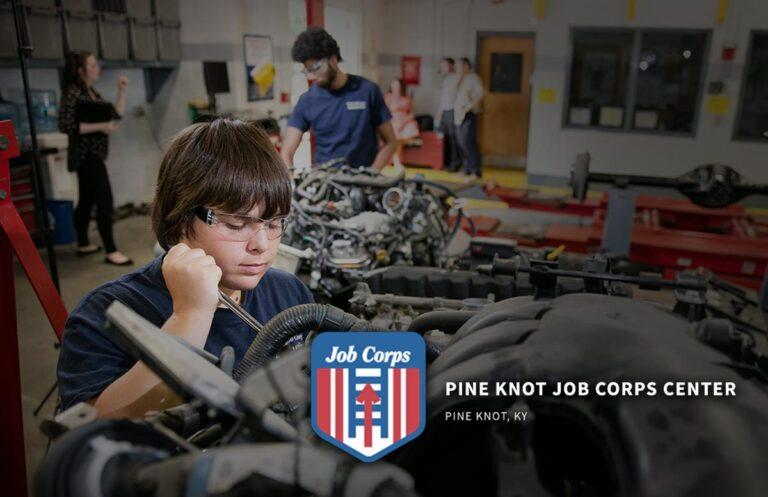 Young people working on machinery with Job Corps logo and Pine Knot Job Corps Center, Pine Knot, KY