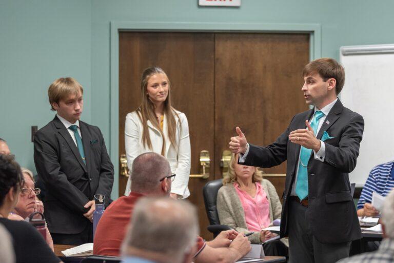 people addressing a meeting