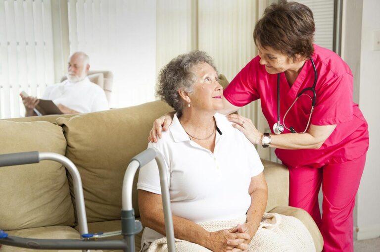 Nurse comforting an elderly patient