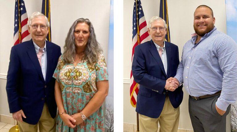 a man an woman posing with Kentucky Senator Mitch McConnell